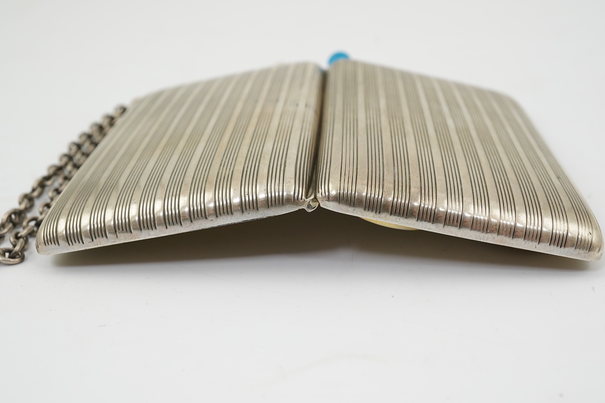 An early 20th century continental 800 standard silver combination, card, coin, aide memoir and pill case, with pencil and ribbed decoration, maker WK